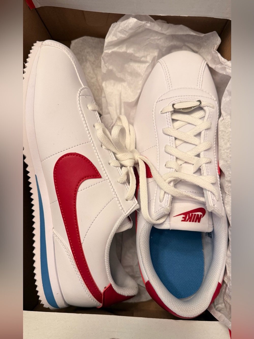 Nike White Sneakers with Red Swoosh and Blue Insole